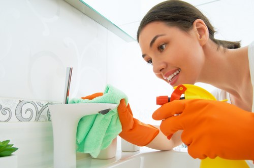 Cleaning technician responding to workplace emergency procedures